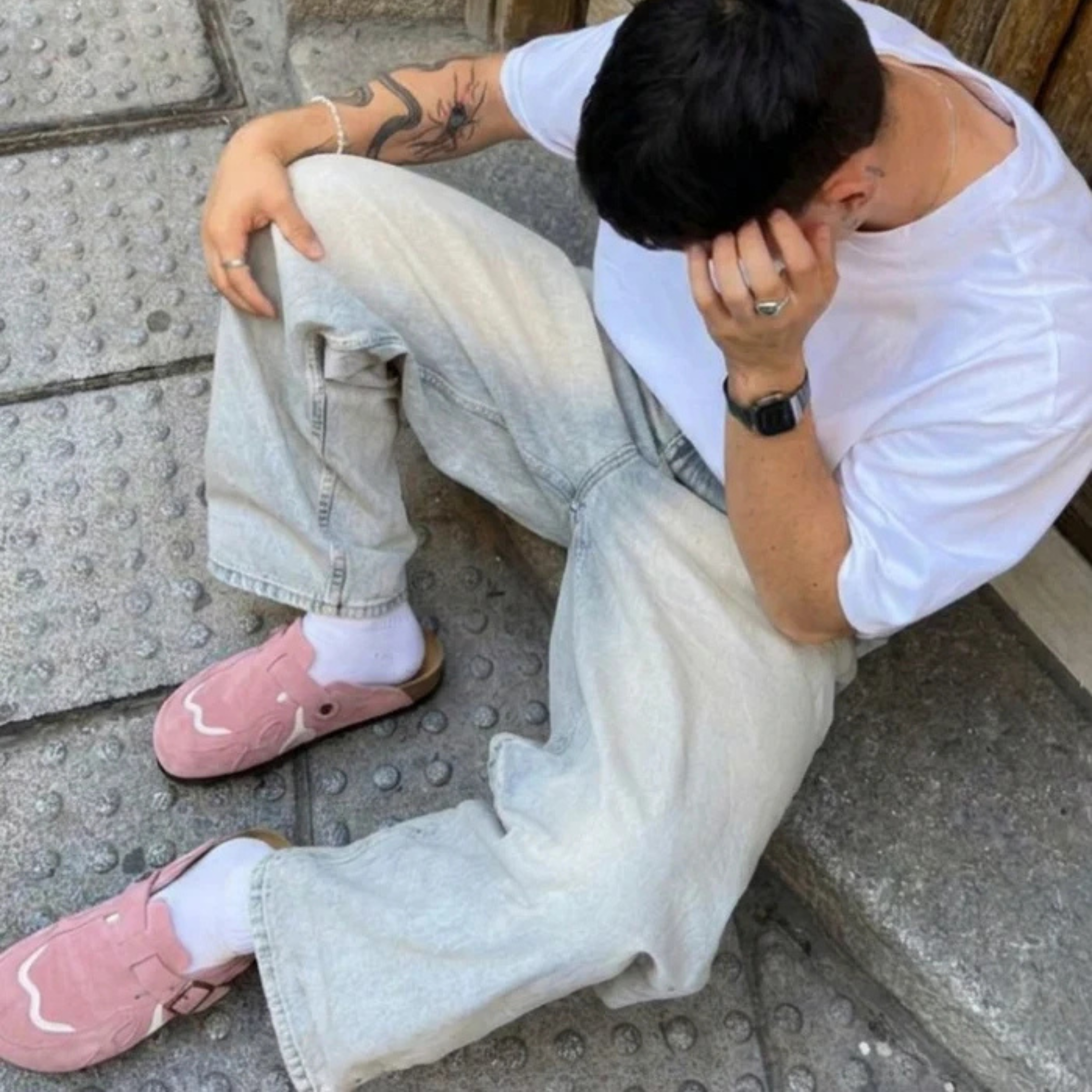 Model wearing Wavey Clogs in pink with light wash baggy jeans