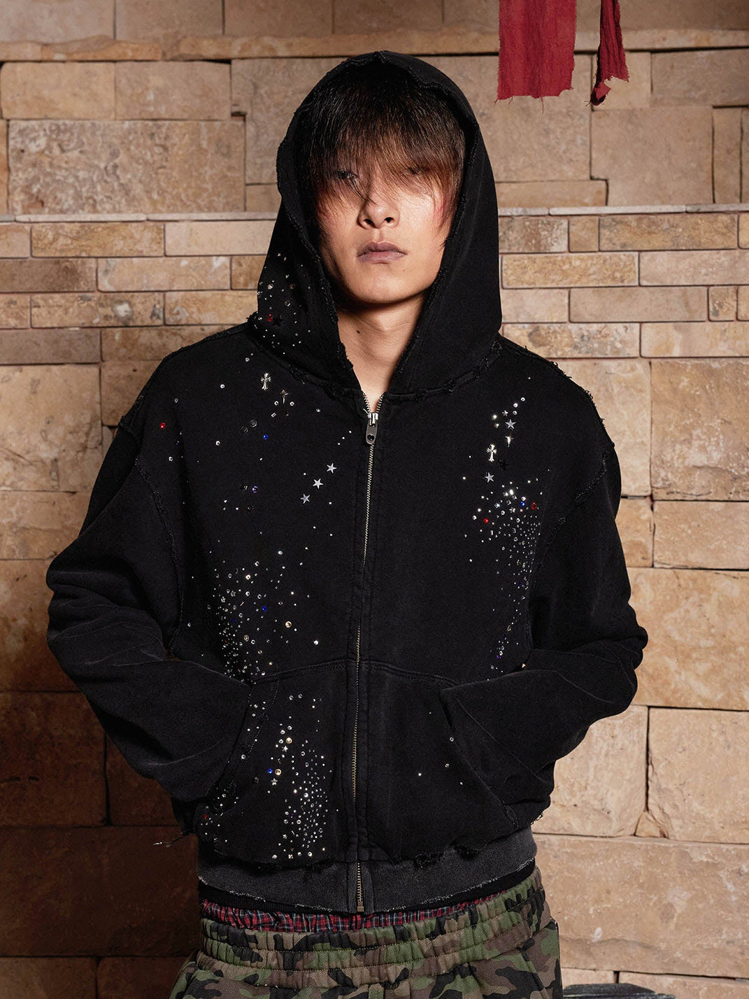 Rhinestone hoodie hood up — front view with colorful studs