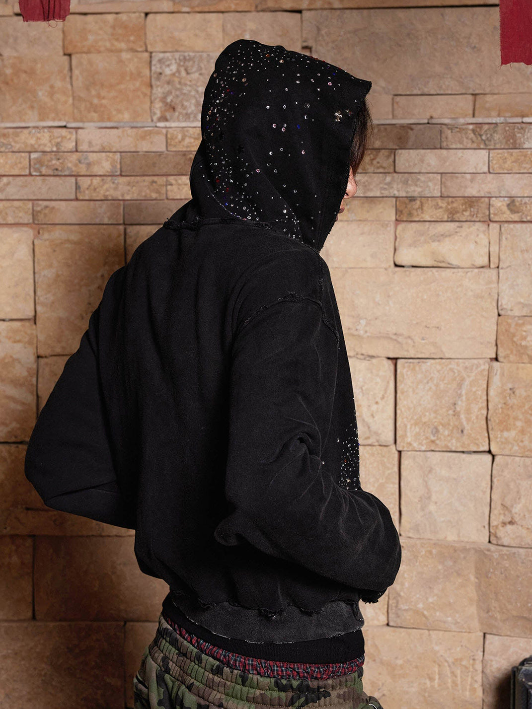 Studded hoodie back view — drop shoulder boxy fit