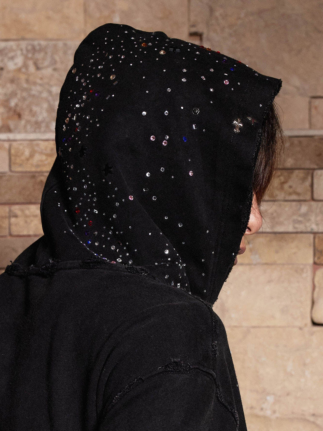 Rhinestone stud detail on hood — sparkle close-up