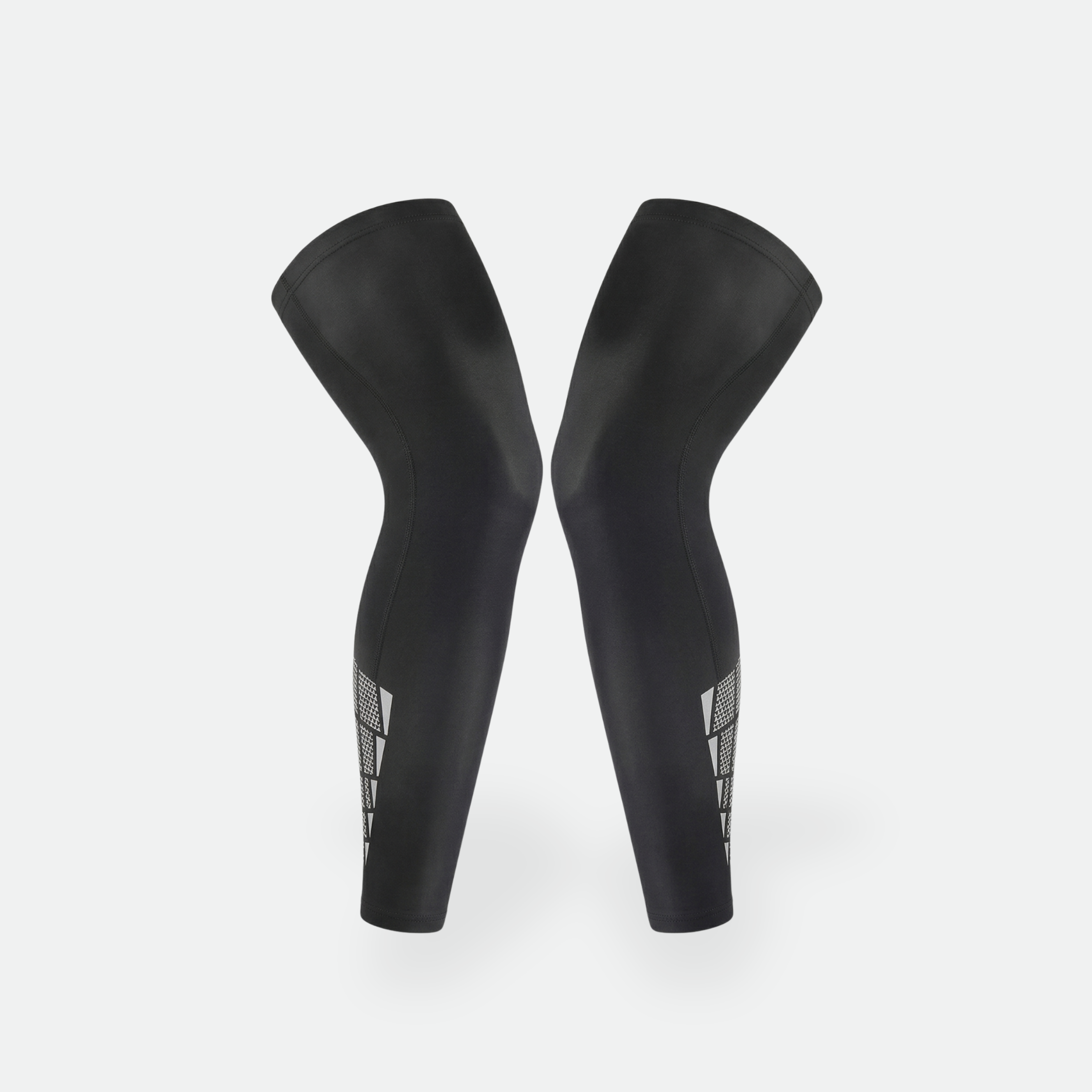 Pair of black compression sleeves on a white background