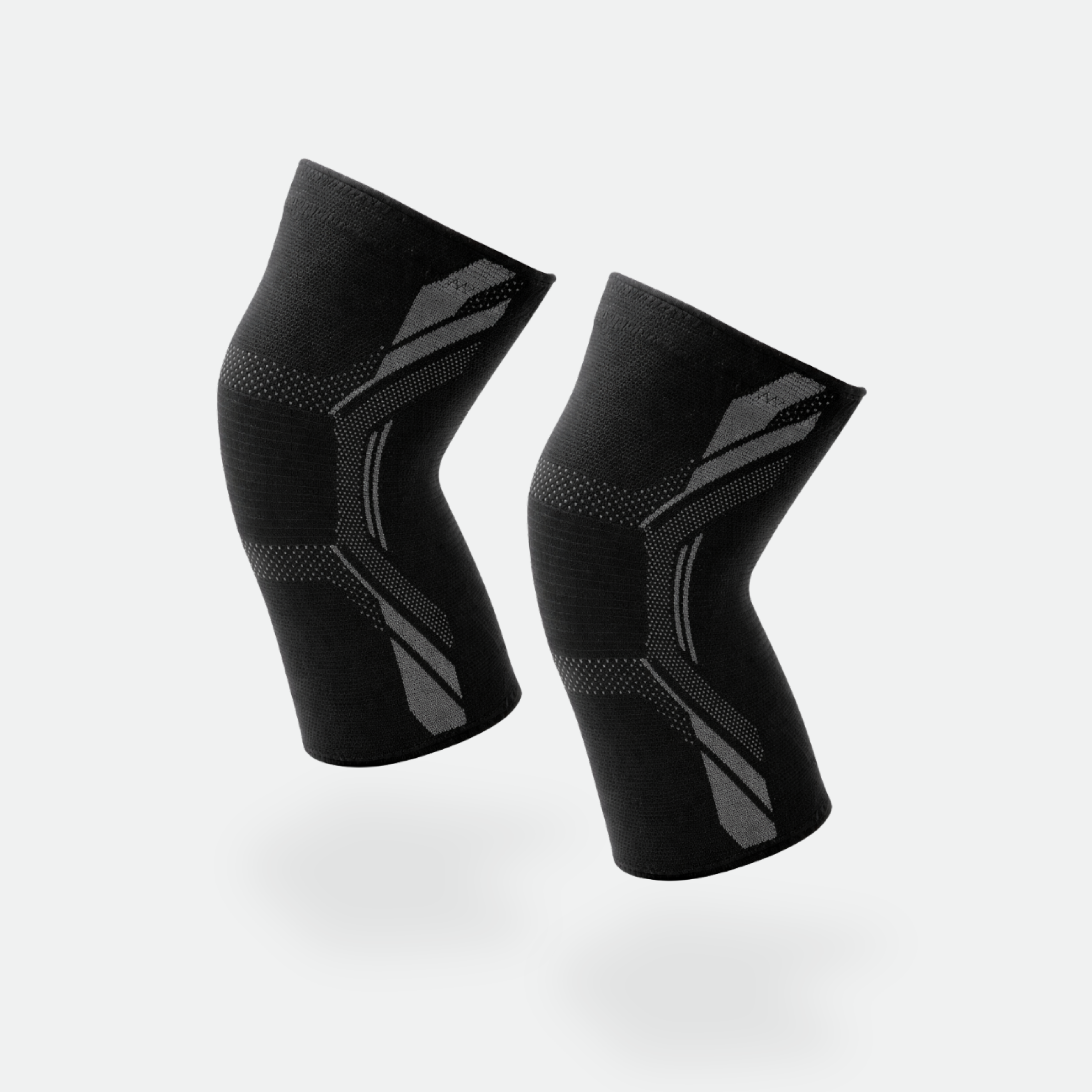 Pair of black knee sleeves on a light gray background