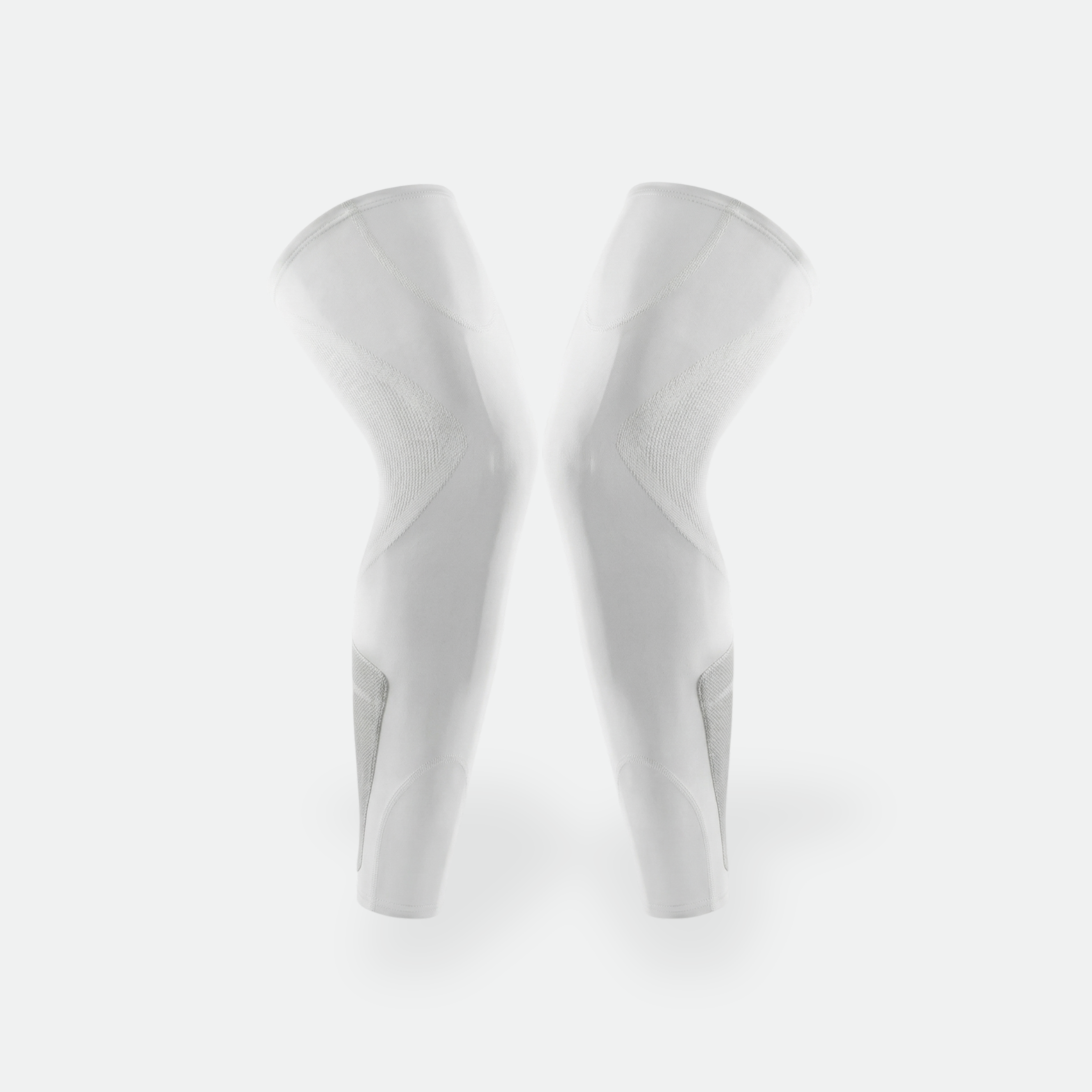 White knee-high socks on a light gray background