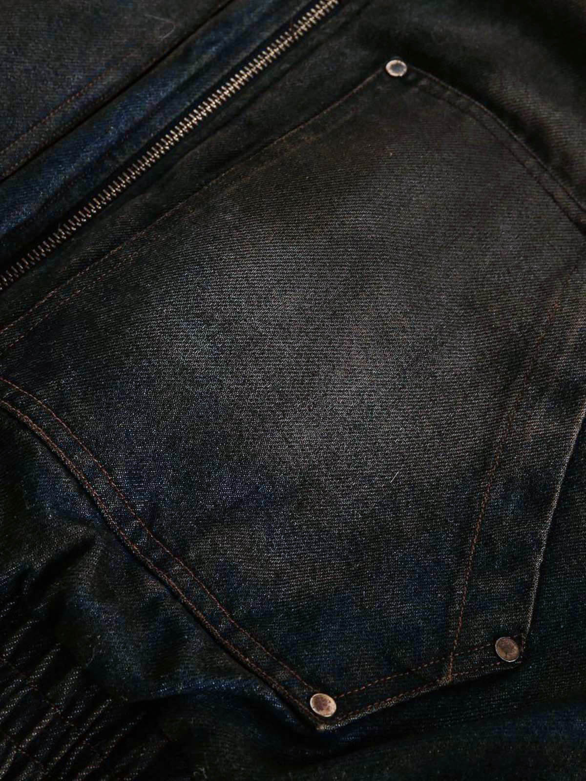 Chest pocket and rivet detail on washed denim