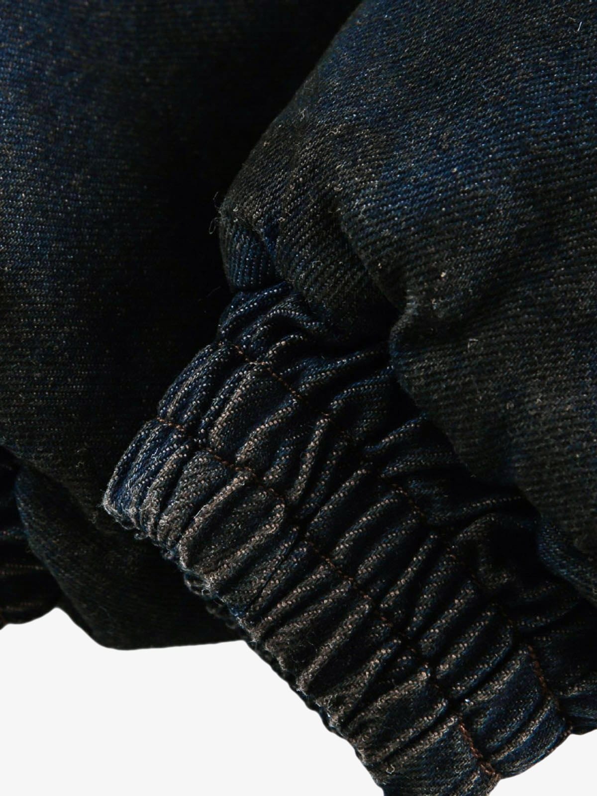 Elastic cuff and hem detail on denim bomber jacket