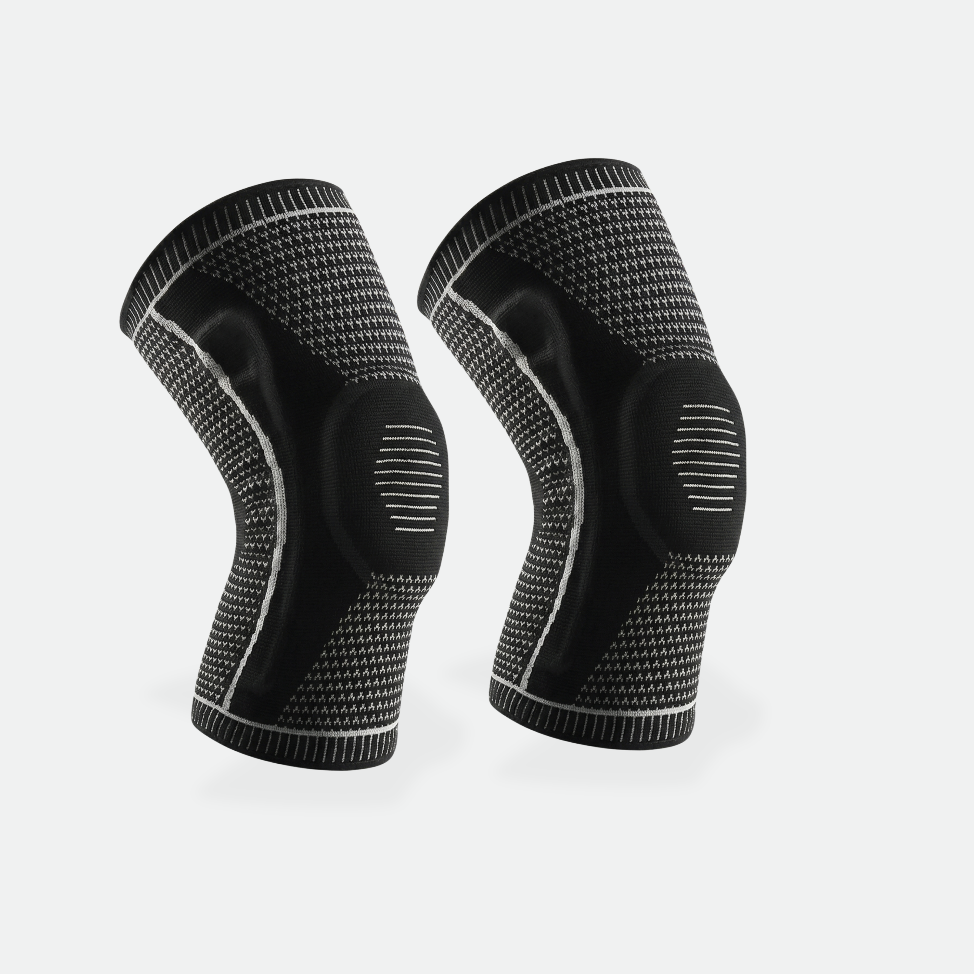 Pair of black knee sleeves on a light gray background