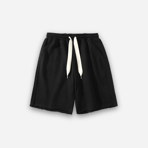 Black shorts with a drawstring on a white background